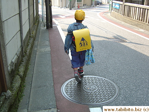 Looks like he can't wait to dump his heavy backpack