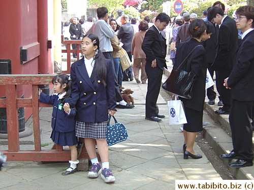 Two girls at Nezujinja. Did they come here straight from school, on Sunday?