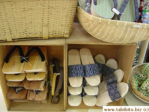 Wooden sandals for men on the left
