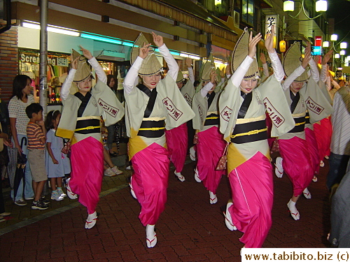 Traditional Awaodori dancers, they always wear those pointy straw hats