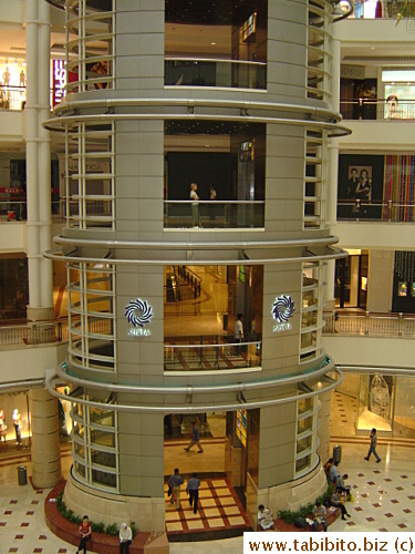 The glass elevator inside Suria KLCC