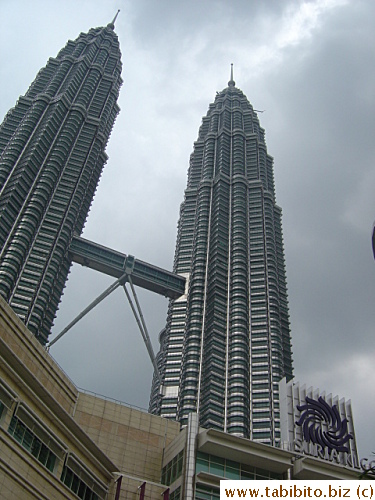 You can't have a building visited by tens of thousands every month and not have a mall close by (preferrably inside), that will be a waste of commercial opportunity.