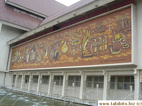 The large painting on the wall of the museum we visited