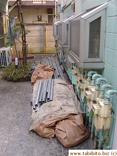 Scaffolds in our apt courtyard left by workers are ready to be set up for the paint job