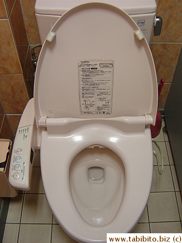 An electric toilet seat in the restroom of a McDonald's restaurant
