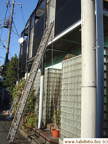 Painters use a ladder to get into our upstairs balcony