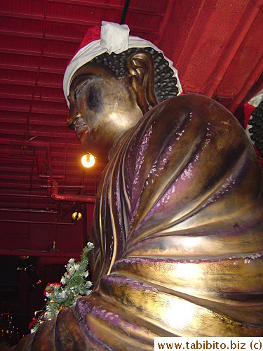 I took this picture from my seat.  Our table's right next to the giant Buddha statue in the restaurant.  It has gone all festive with a Santa hat