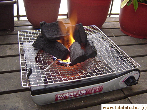 I burn the charcoal on the portable stove to speed up the heating process