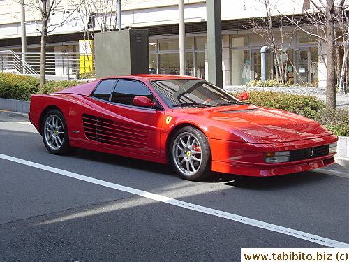 We spotted a Ferrari parked on the street among some BMW and Benz