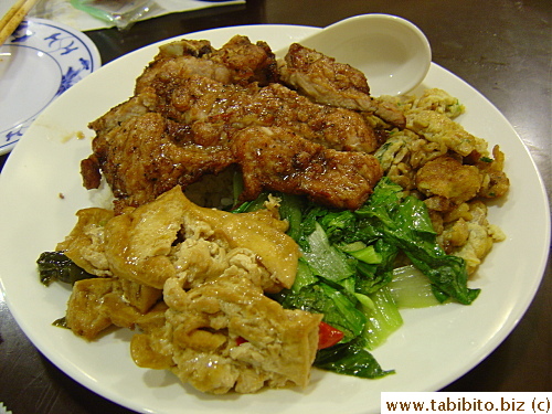 Pork chop over rice with cold side dishes. I don't quite care for the cold tofu, vegies and stir-fried eggs, they remind me of left-overs