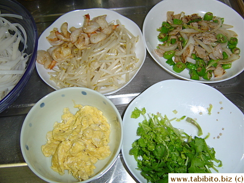 All the ingredients except the coriander are stir-fried before the noodles go into the wok