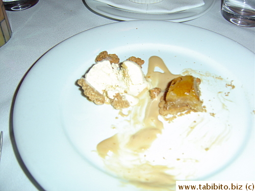 A half-eaten apple tart and apple ice-cream