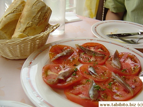 Tomato salad.  It's just tomato slices topped with anchovies and drizzled with olive oil.  The bread's very doughy in taste, not very good