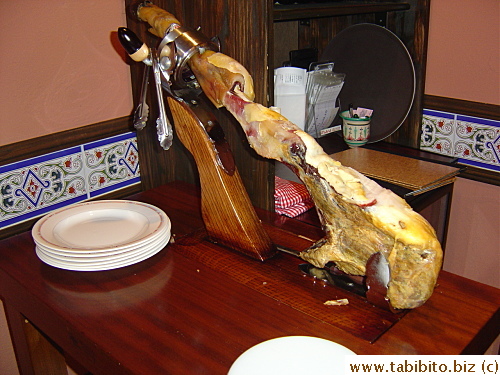 A leg of serrano ham adorns a corner of the restaurant