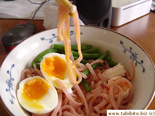 The noodles are bouncy and chewy.  Dipping it in runny yolk before the sauce makes it extra tasty