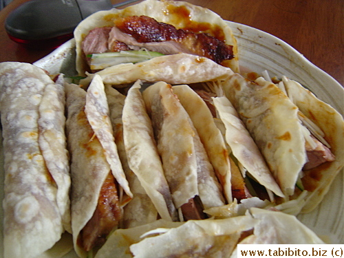 A plateful of homemade Peking duck in crepes, very delicious 