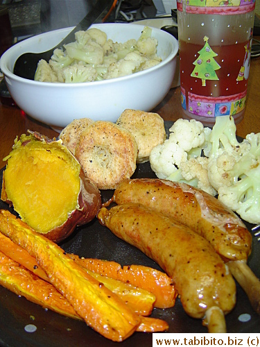 Our dinner.  That orange-color sweet potato from Kagoshima is a rarity in Tokyo and that one cost US$3!  It is the closest thing to yams I can find and KL and I shared it 