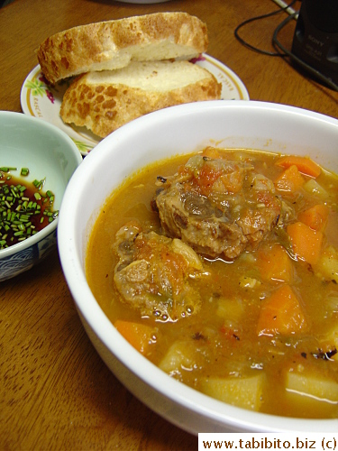 Oxtail soup and Dutch bread for lunch.  The soy sauce with finely chopped scallions is a dipping sauce for the oxtails