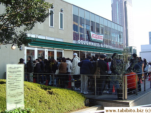 Look at all those people waiting to buy donuts!