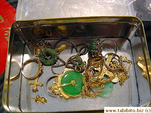 The metal box in the above picture contained these. The rusty chain and jade jewelry were not sellable