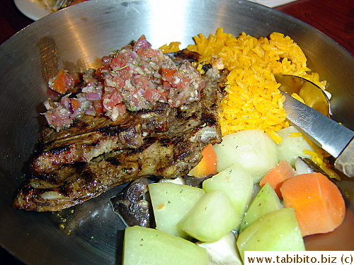 Grilled Pork Chops with pilaf and vegetables.  Yummy pork but a bit overcooked and tough