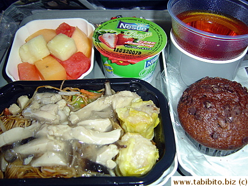 Hong Kong to Tokyo breakfast.  The fruit's nice and sweet, the noodles good, but the muffin sucked