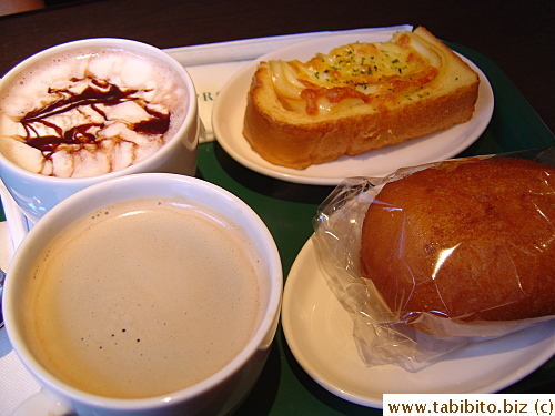 Samuel and KL had cappuccino and Americano coffee, me an OJ. Also a cheese and egg toast for S and a curry bread for me