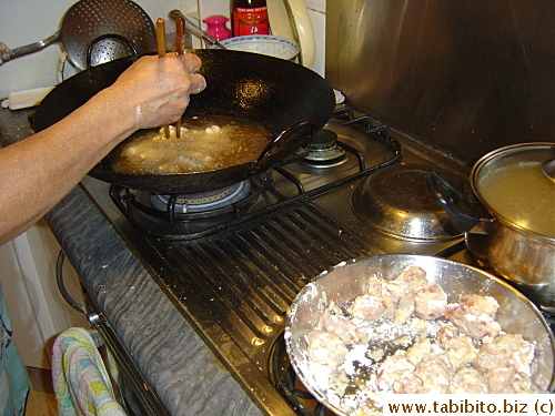 Mom cooking labor intensive sweet and sour pork