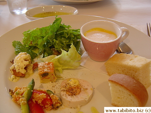 The server explained the food on the platter but I didn't catch a word he said.  I know there's a piece of fried fish,couscous salad and chicken there, perhaps cream of pumpkin soup with foam?)