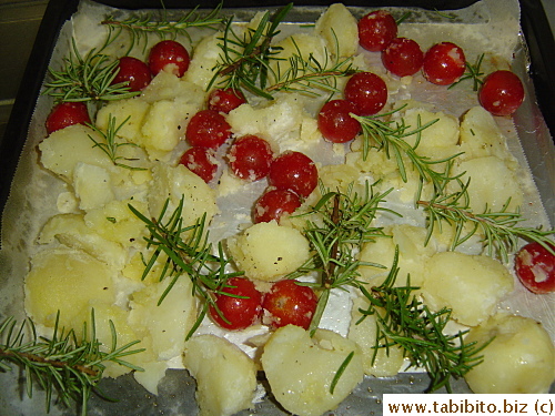 Dump them onto a baking tray and scatter rosemary around