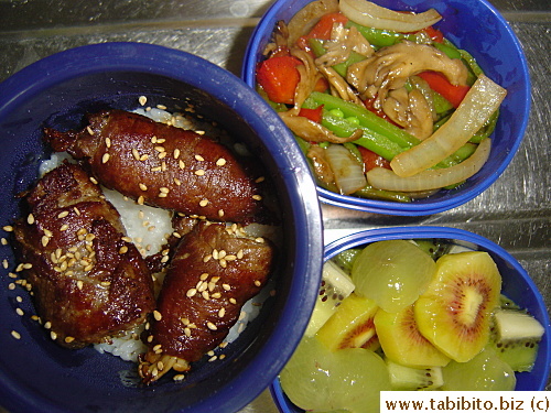 Beef and enoki rolls, stirfried mixed vegetables, rainbow kiwi and grapes