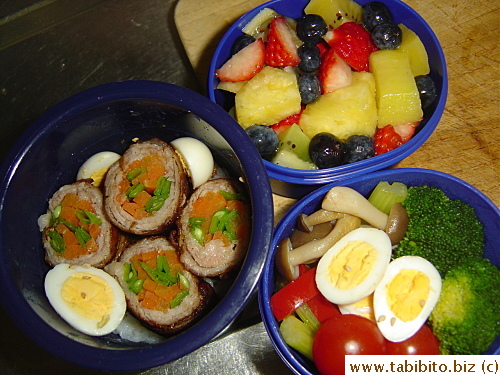 Carrot and snow pea-stuffed pork, quail eggs, stirfried mixed vegetables, broccoli, cherry tomatoes, fruit salad