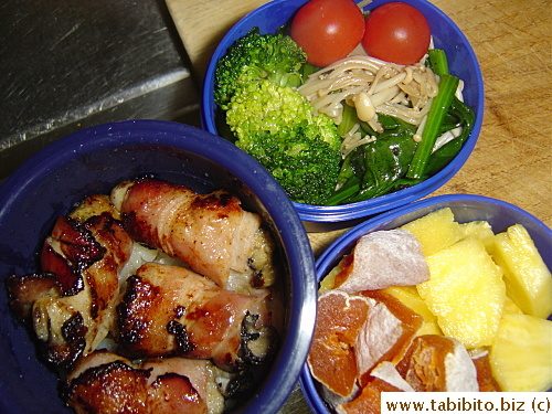 Bacon-wrapped oysters, sauteed enoki and spinach, broccoli, cherry tomatoes, pineapple and dried persimmon