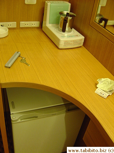 The room may be tiny, it has just about everything one needs including a mini hot plate, a humidifier and a fridge