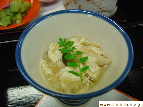 Tofu skin in dashi broth with unidentifiable veggies