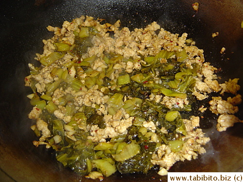 Then I removed it, browned the pork and garlic and chilli, add some wine, soy, sugar and returned the takana to the wok