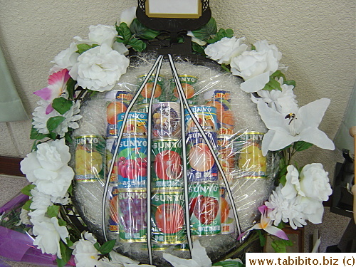 I asked my friend the meaning behind the canned fruit offerings but she doesn't know.  She says she's just following custom