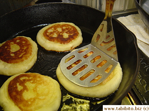 A potato masher works great in flattening them