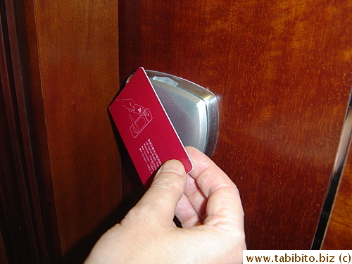 Tapping it on the room door unlocks it