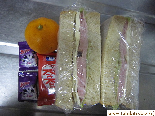 Ham and cheese sandwich, mandarin, KitKat, Ribena candies