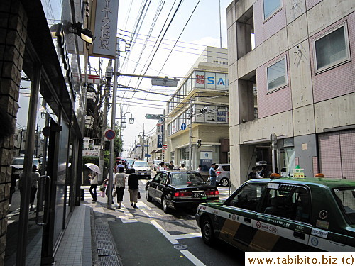 Walk to the end to the traffic lights and turn left