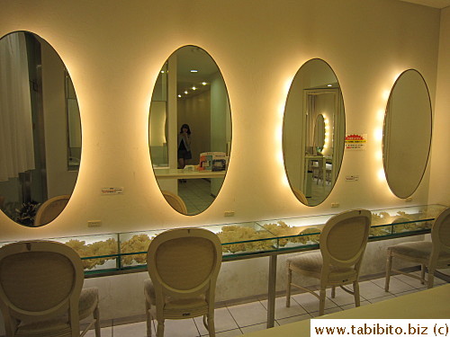 In the vanity area, the dressing table has flowers in it