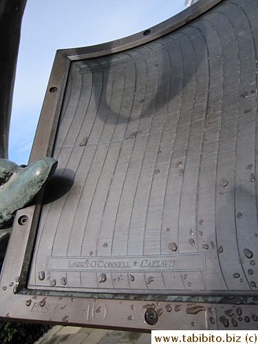 The shadow cast by the meeting point of the dolphin tails tells the time!