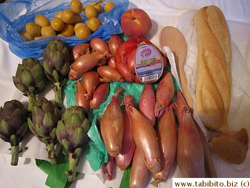 Bought fresh dates, baby purple artichokes, three kinds of shallots,a baguette (half eaten) and a wooden spoon at Bastille Market