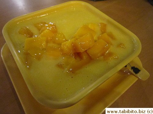 Fresh mango in mango puree over tofu-fa