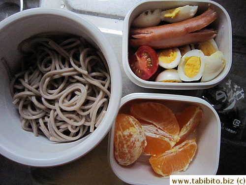 Chilled soba noodles, sausage, quail eggs, cherry tomatoes, mandarin