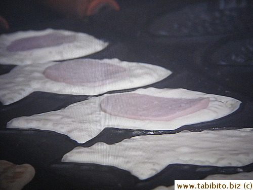 The usual sweet bean paste filling is replaced with ham,