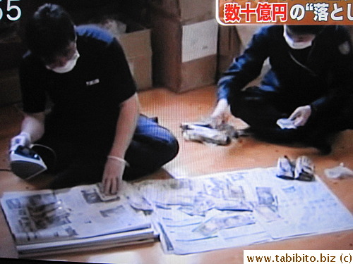 Workers painstakingly clean and iron each bill!