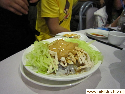 Shredded chicken, cucumber and rice sheets in a thick peanut dressing