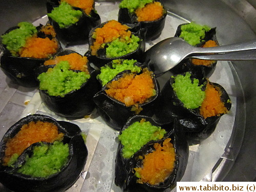 Steamed dumplings in squid ink wrappers
